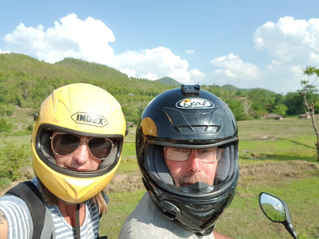  Showing off our helmets. No visors but thankfully our glasses protected our eyes from the bugs