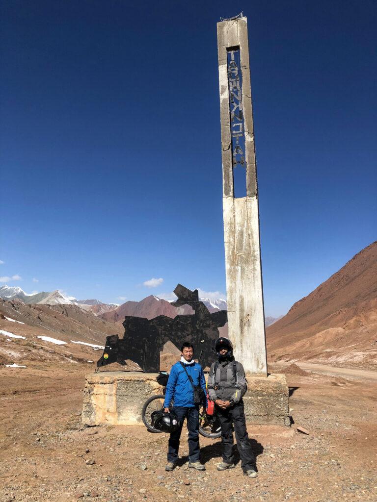 Ashim and Yosuke at the peak of Ak Baital Pass (worlds 3rd highest border crossing) between Kyrgyzstan and Tajikistan