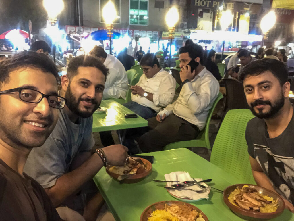 Dinner with new friends in Pakistan after a long day of toil over a GSXR